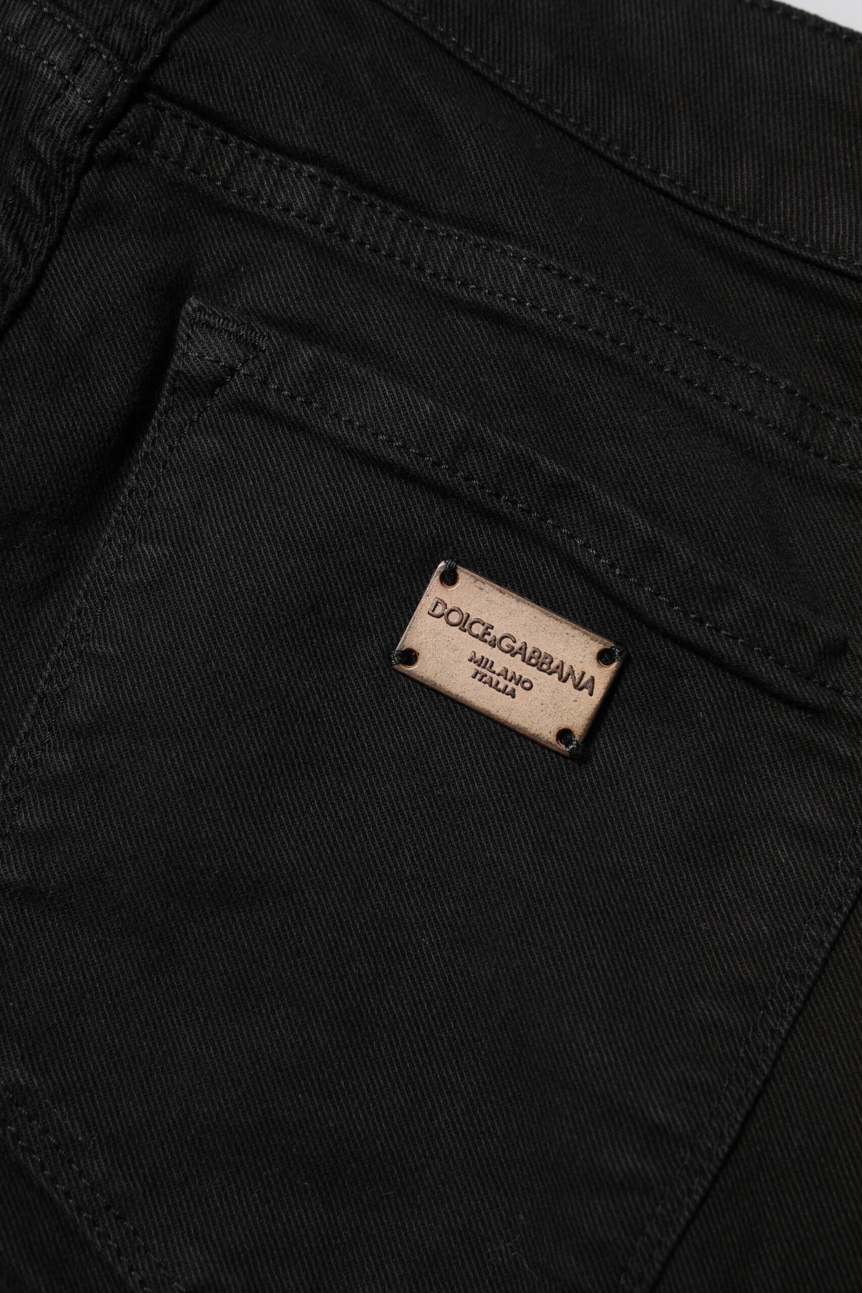 Jean skinny noir en coton Dolce & Gabbana, coupe mi-haute, denim élégant avec détails modernes.