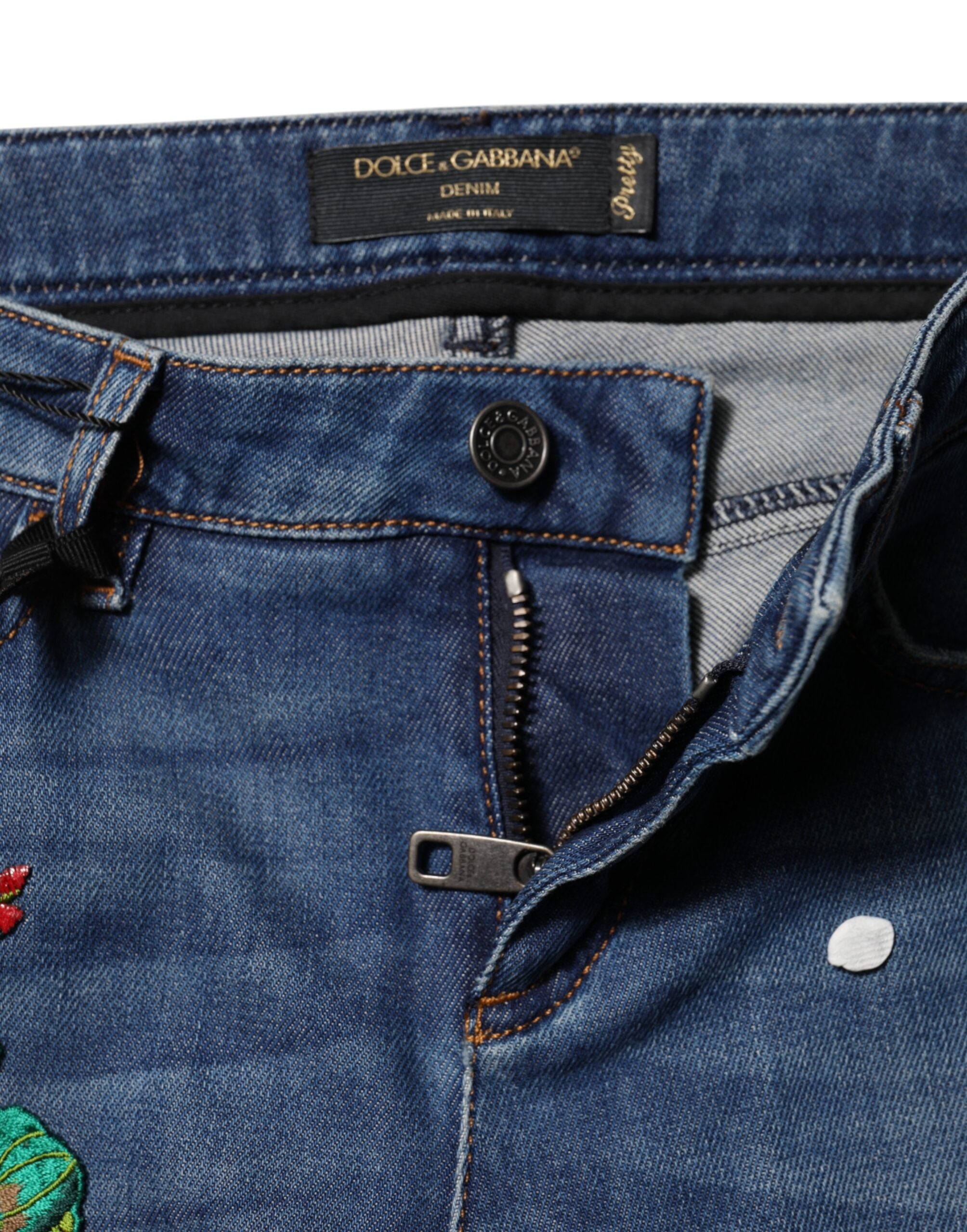 Jeans skinny en denim bleu à taille basse de Dolce & Gabbana, coupe ajustée et tissu coton léger, pour un style élégant.