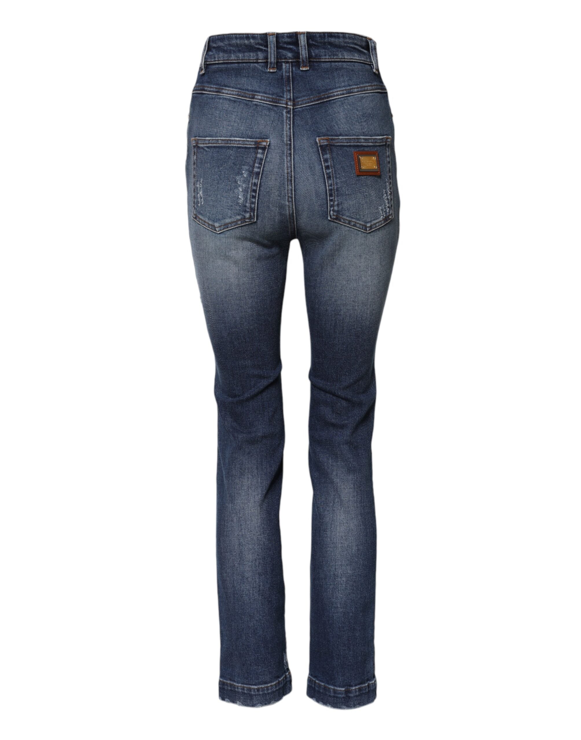 Jean en denim Dolce & Gabbana ornés de strass bleus et embellissements en strass, vue de face.