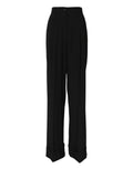 Pantalon formel noir en laine à taille haute de Dolce & Gabbana, visible en gros plan sur image.