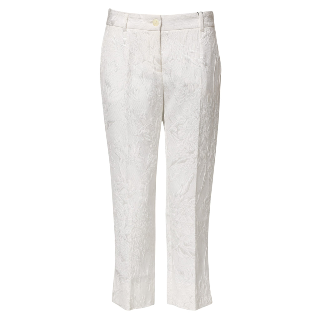 Pantalons en coton blanc à jacquard floral Dolce & Gabbana, élégants et confortables, visibles avec motif floral sophistiqué.