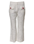 Pantalons en coton blanc à jacquard floral Dolce & Gabbana, élégants et confortables, avec motif floral sophistiqué.