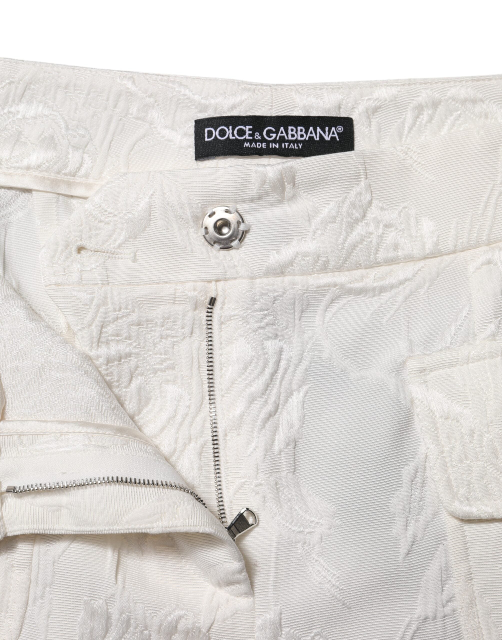 Pantalons en jacquard de coton blanc avec motif floral Dolce & Gabbana, style élégant et confortable.