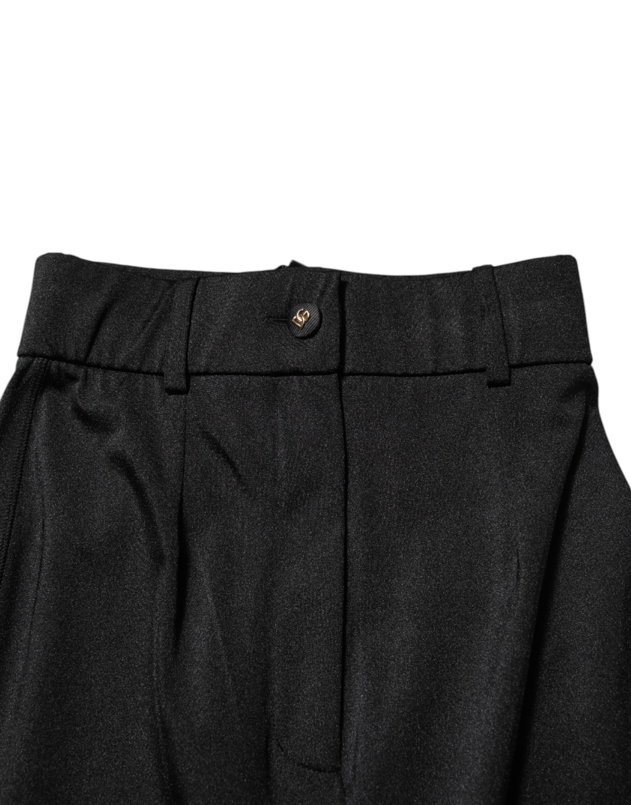 Leggings noires Dolce & Gabbana taille haute, coupe skinny, en tissu extensible, visibles sur l'image.