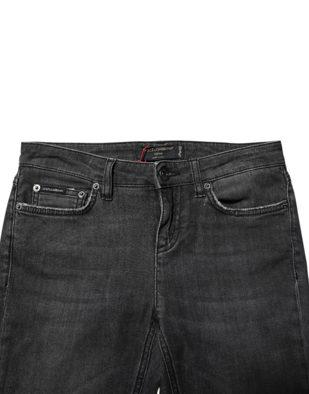 Jeans skinny en coton noir à taille basse de Dolce & Gabbana, coupe ajustée et style moderne, visible sur l'image.