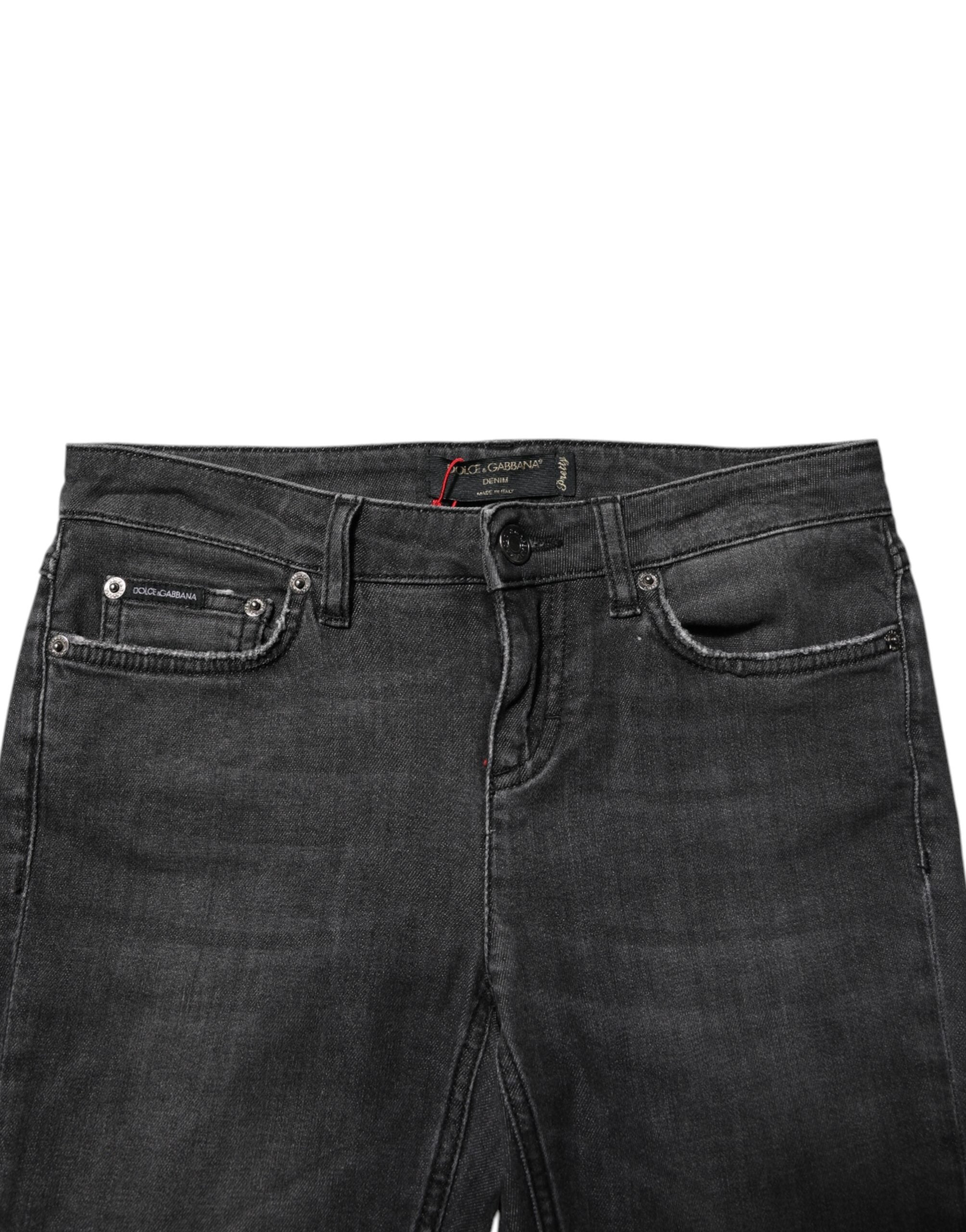 Jeans skinny en coton noir à taille basse de Dolce & Gabbana, coupe ajustée et style moderne, visible sur l'image.