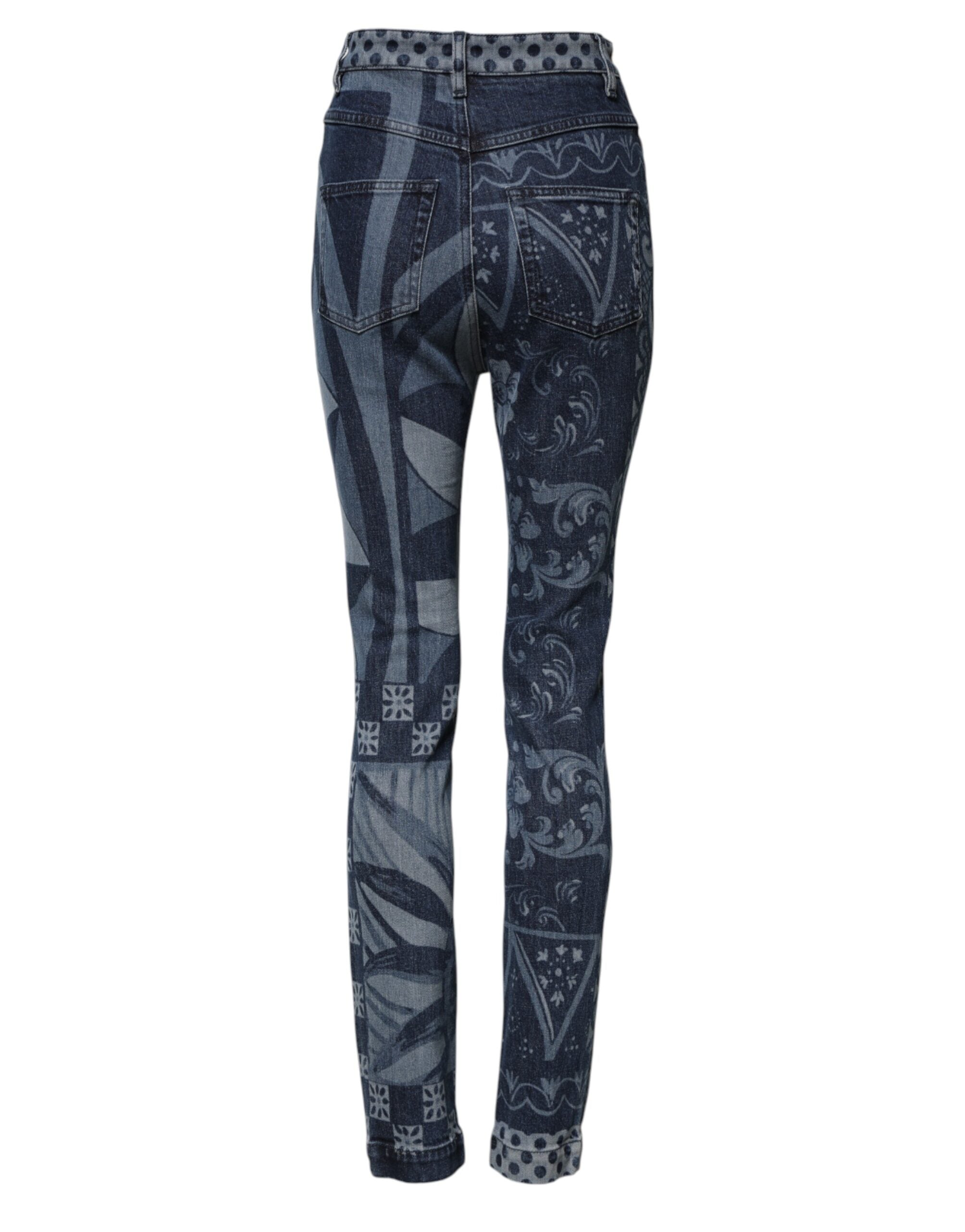 Jean skinny en denim coton Dolce & Gabbana avec imprimé graphique bleu, visible détail du design sur la photo.