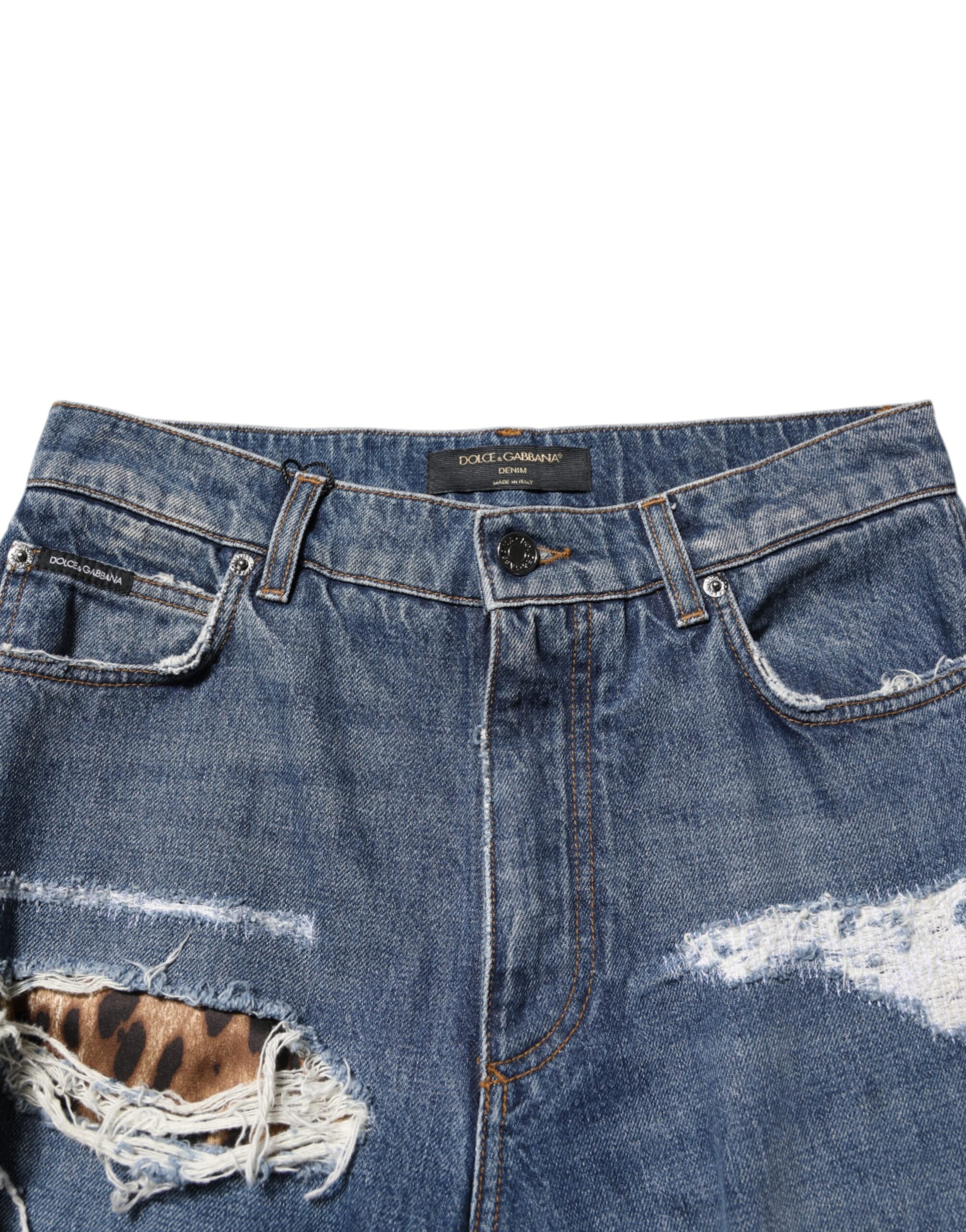 Jean droit en coton déchiré bleu de Dolce & Gabbana, style décontracté avec détails usés sur le denim.