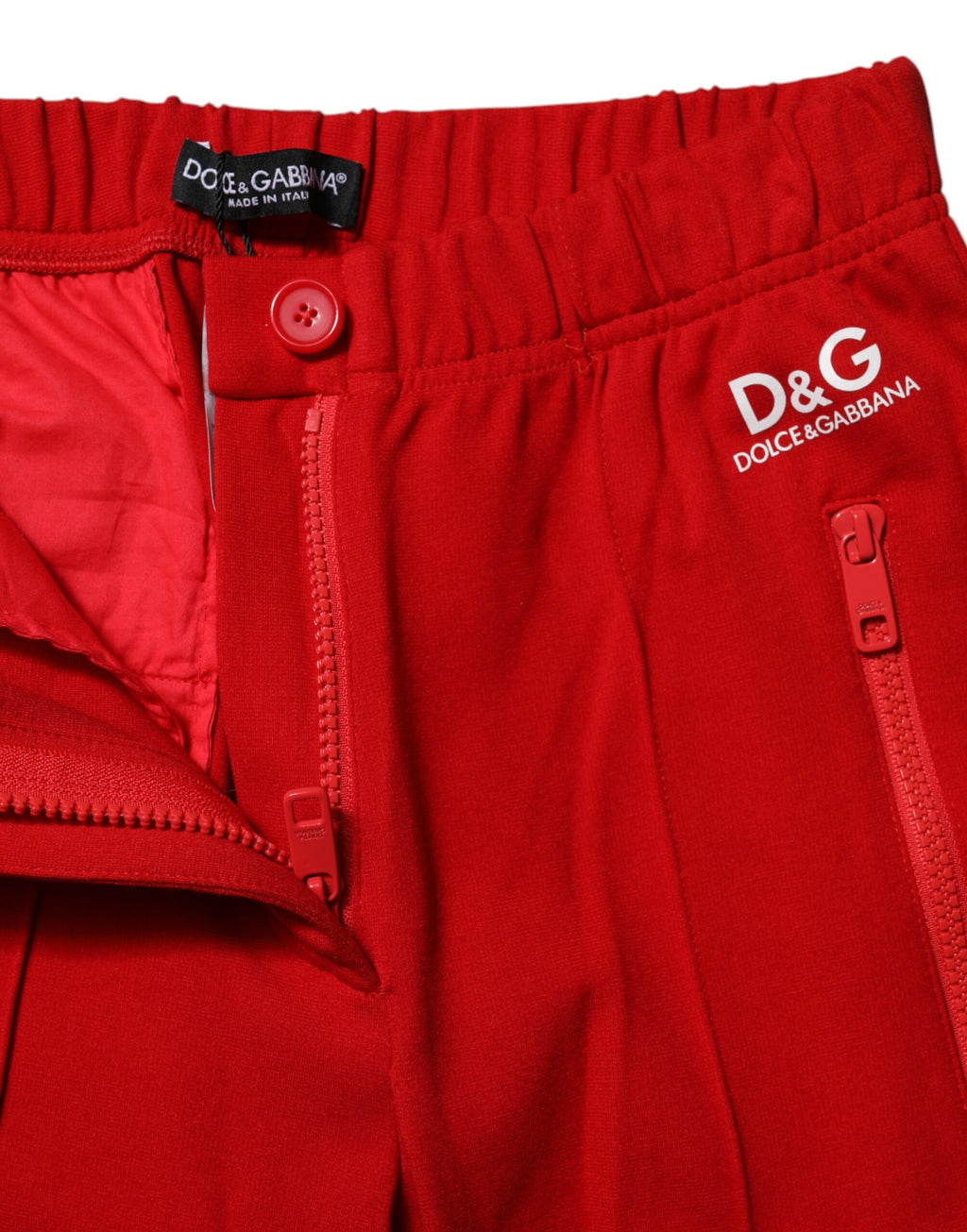 Pantalon Dolce & Gabbana rouge taille moyenne, coupe slim, ajusté, en tissu élégant, visible en gros plan.