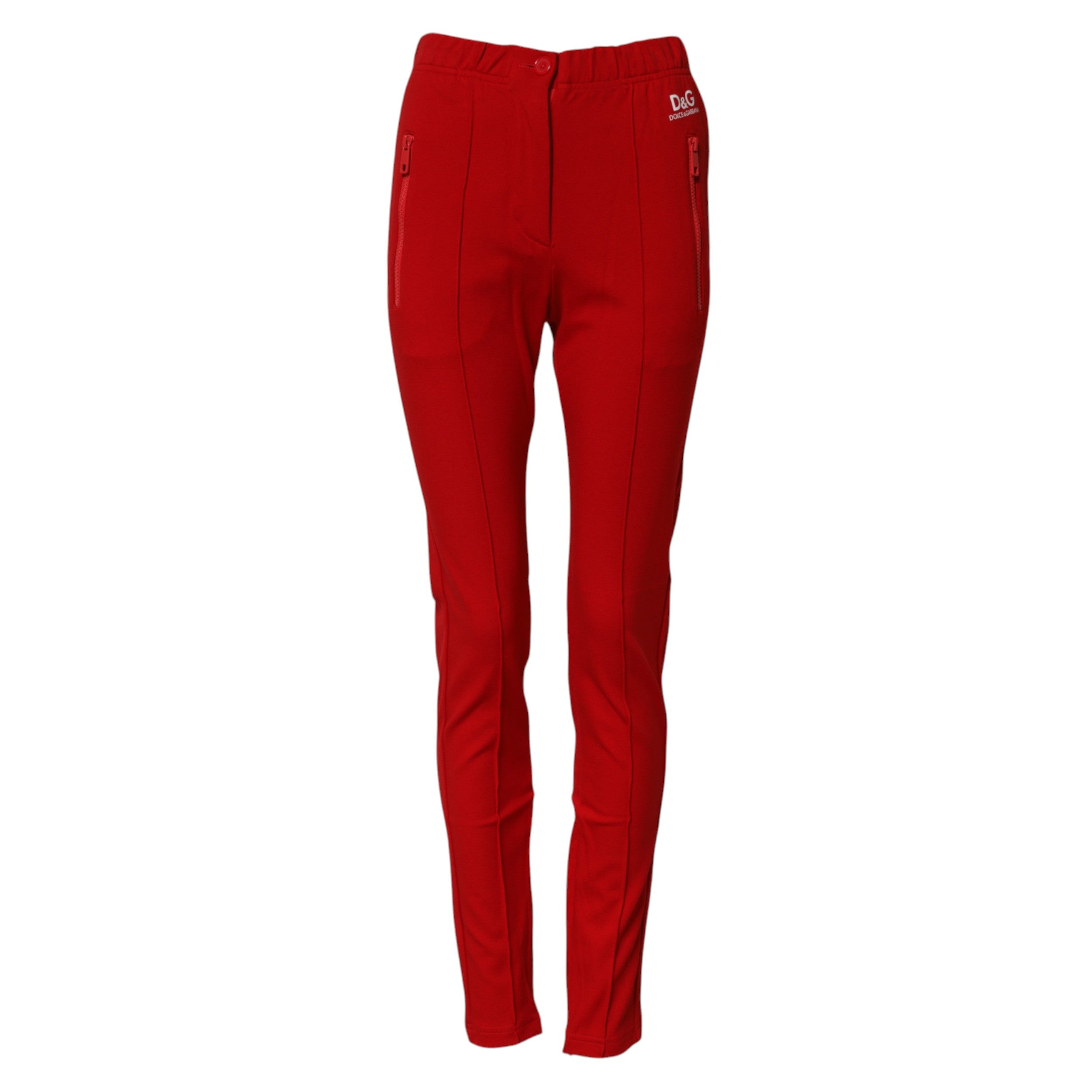 Pantalons slim taille moyenne de couleur rouge de Dolce & Gabbana, coupe ajustée et tendance, sur un fond neutre