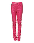 Jeans skinny en coton rose à taille haute de Dolce & Gabbana, coupe moulante et détail tendance visible sur l'image.