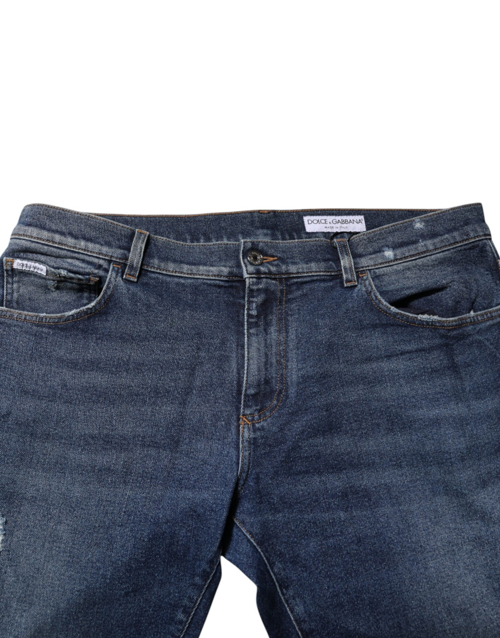 Jeans en denim bleu Dolce & Gabbana, taille moyenne, coupe droite, visibles en gros plan sur l'image.