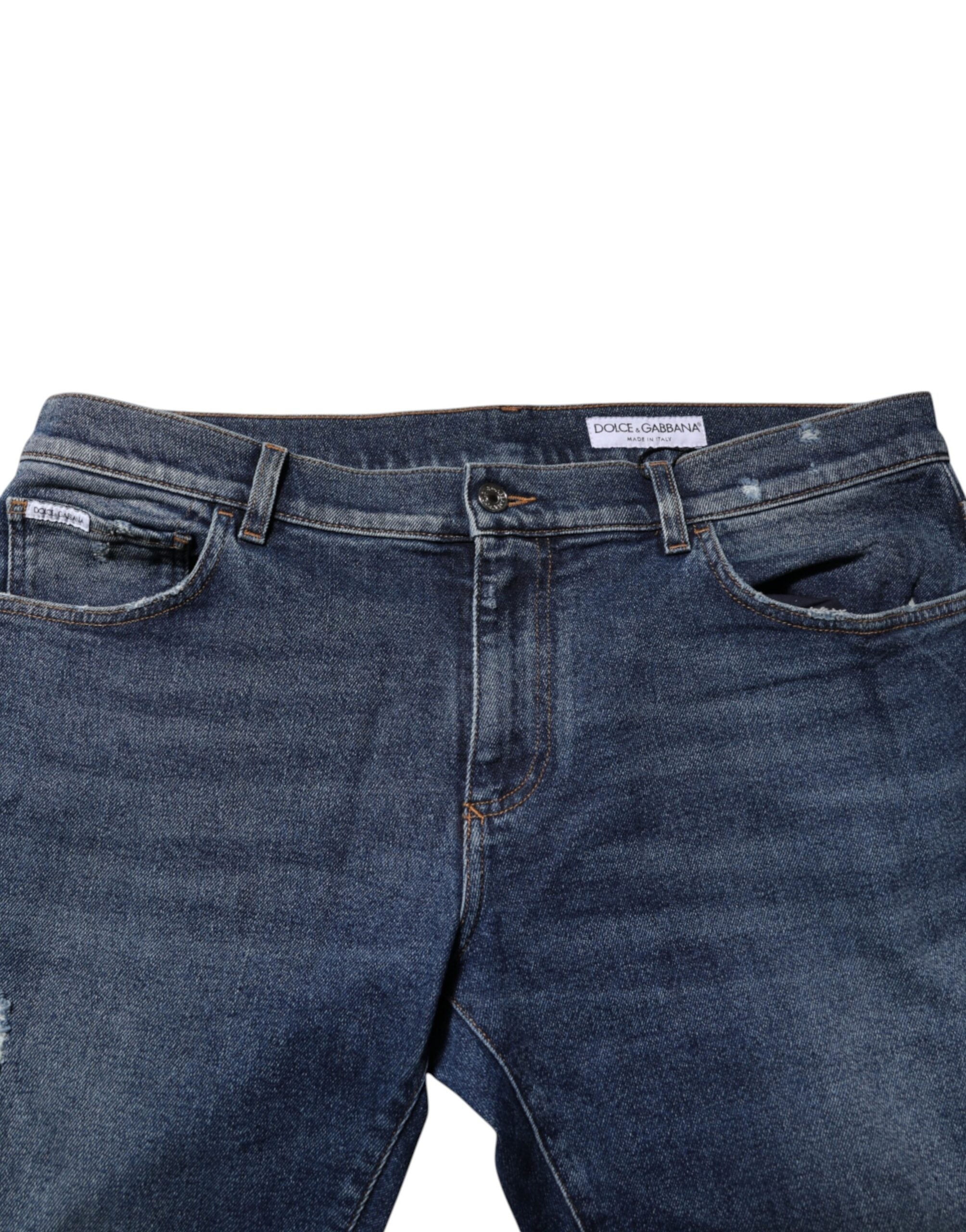 Jeans en denim bleu Dolce & Gabbana, taille moyenne, coupe droite, visibles en gros plan sur l'image.
