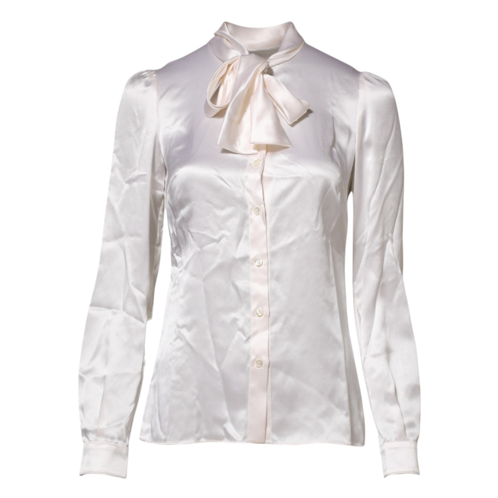 Blouse blanche Dolce & Gabbana à col ascot et manches longues, style élégant et sophistiqué.