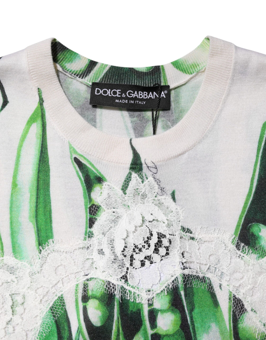 Haut sans manches Dolce & Gabbana blanc avec imprimé pois vert, style élégant et léger, tissu fluide et tendance.