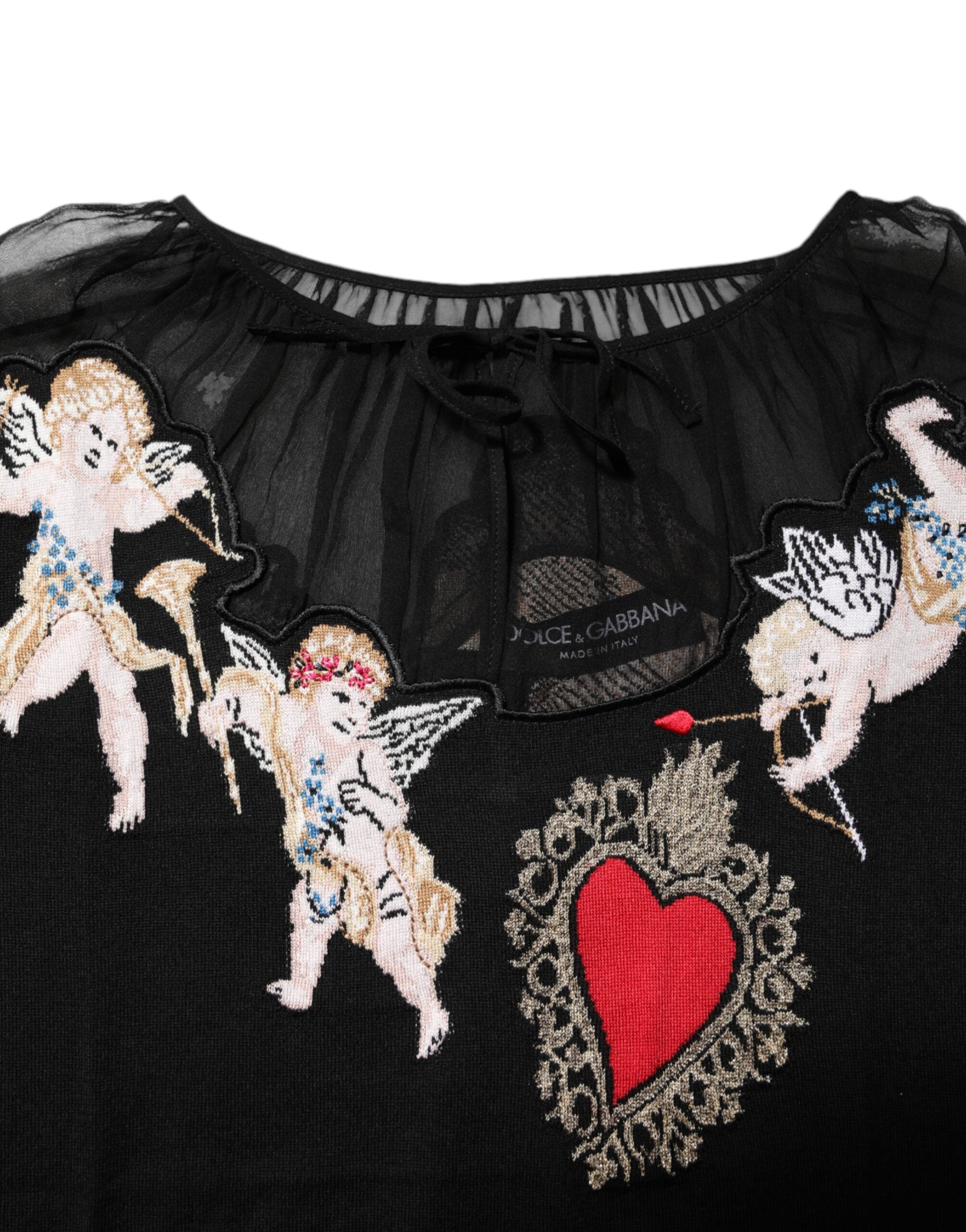 Pull à col rond noir Dolce & Gabbana avec broderie en forme de cœur sacré sur la poitrine.