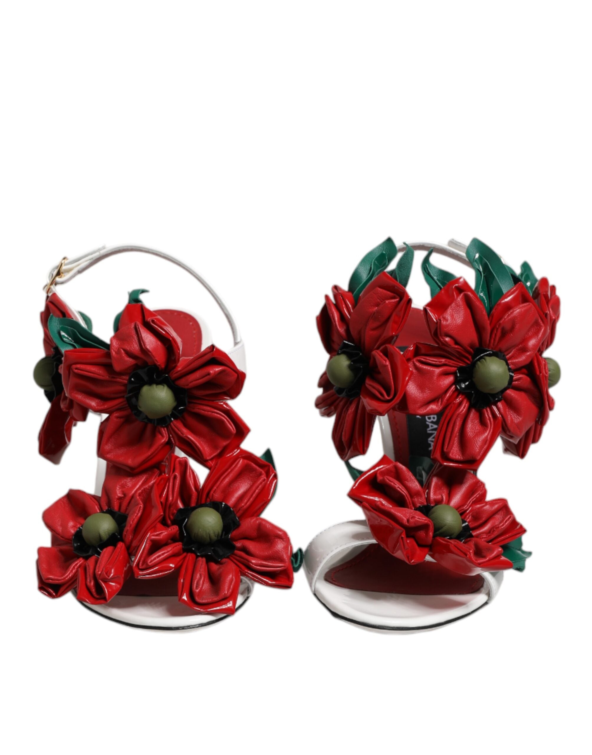 Sandales en cuir blanc Dolce & Gabbana avec détails floraux, semelles plates et design élégant.