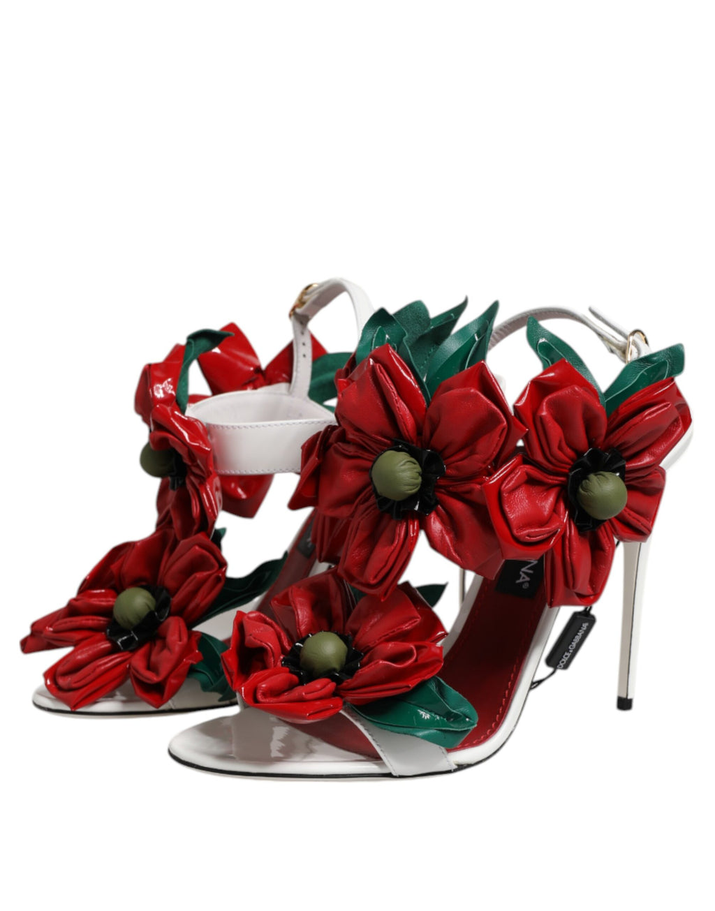 Sandales en cuir blanc Dolce & Gabbana avec détails floraux, semelle plate et style élégant, vues de côté.