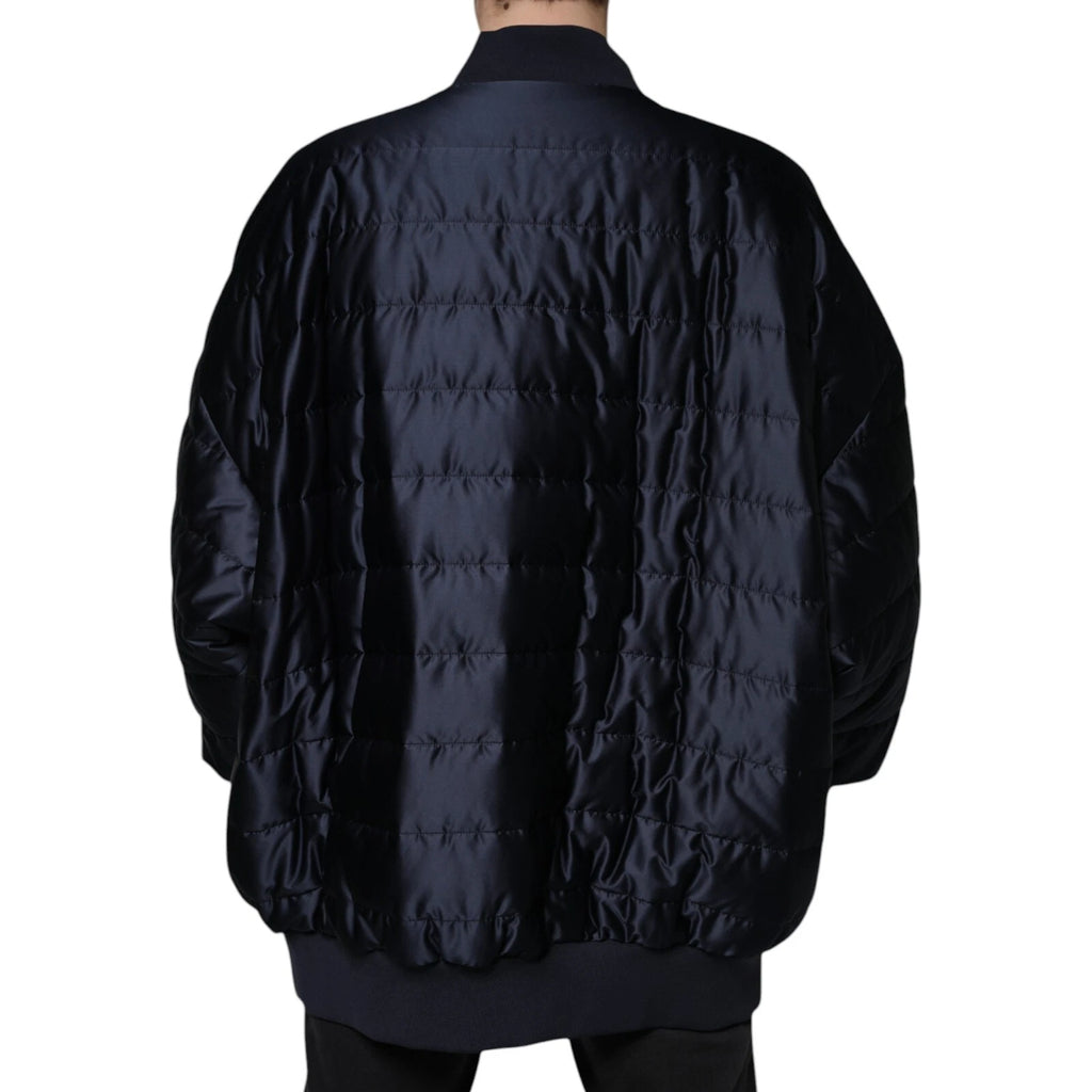 Veste bomber matelassée bleu foncé Dolce & Gabbana à fermeture éclair complète, style élégant et moderne.