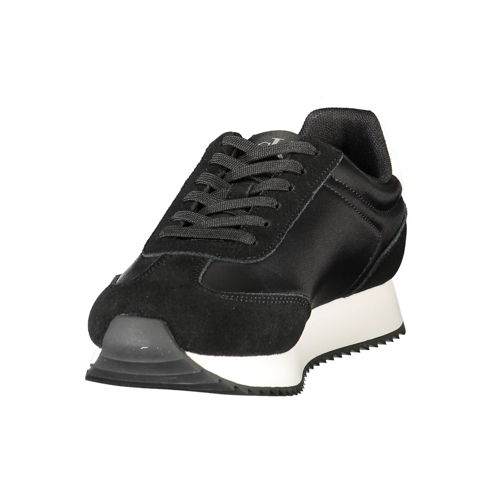 Chaussures sneakers pour femmes Calvin Klein en cuir noir, modèle Nero, vue de côté.