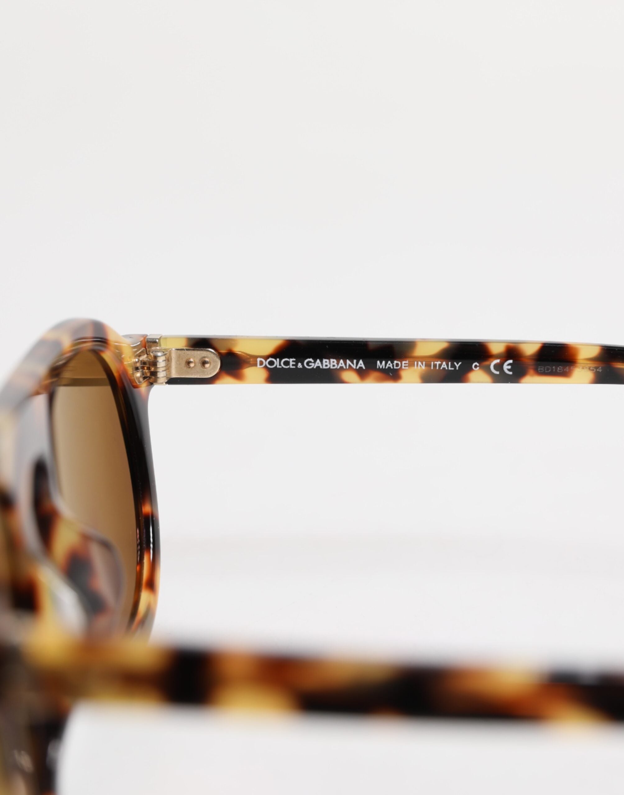 Lunettes de soleil rondes Dolce & Gabbana en acétate marron avec motif léopard, style élégant et tendance
