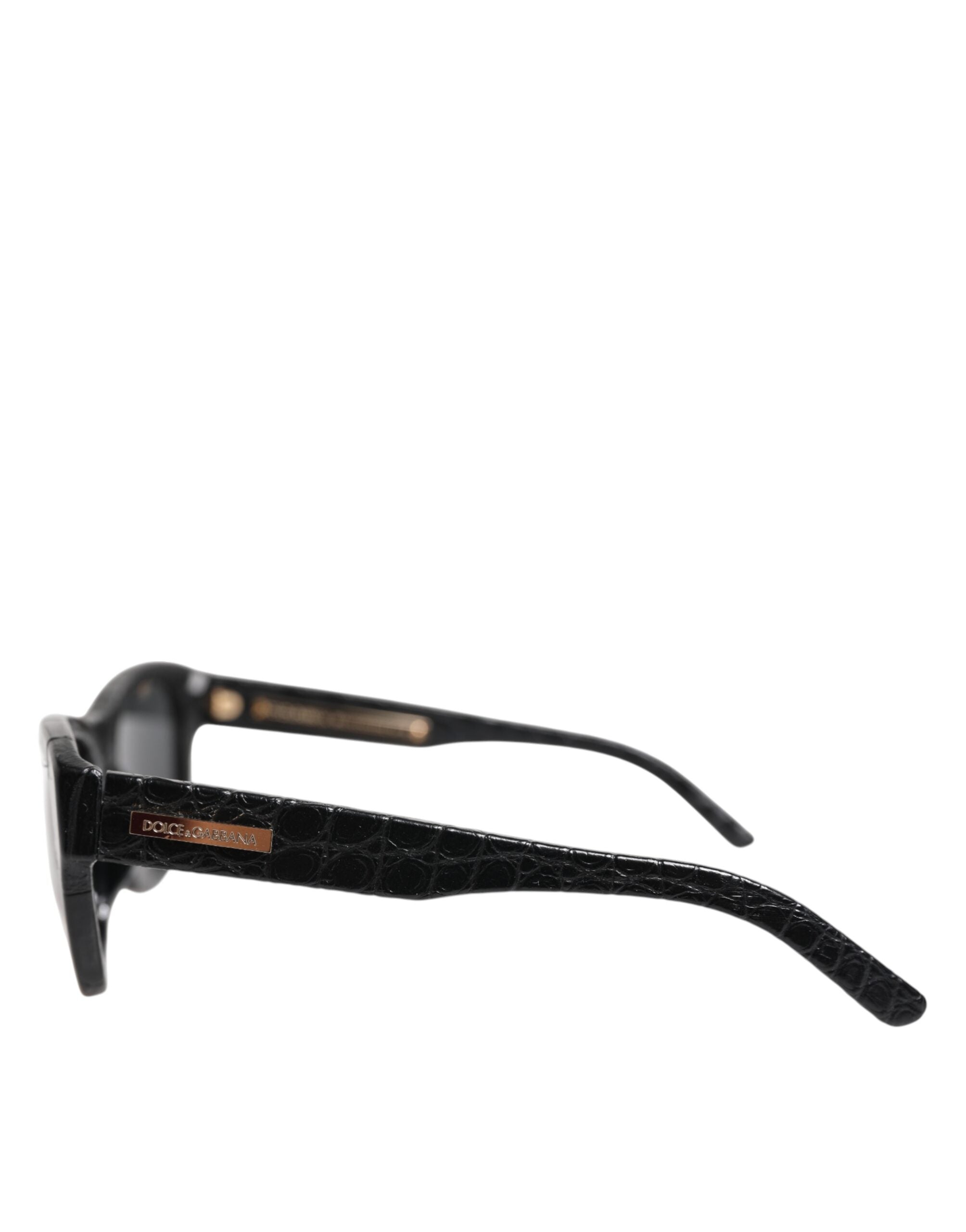 Lunettes de soleil Dolce & Gabbana en cuir noir avec monture rectangulaire et verres teintés, style élégant et moderne.