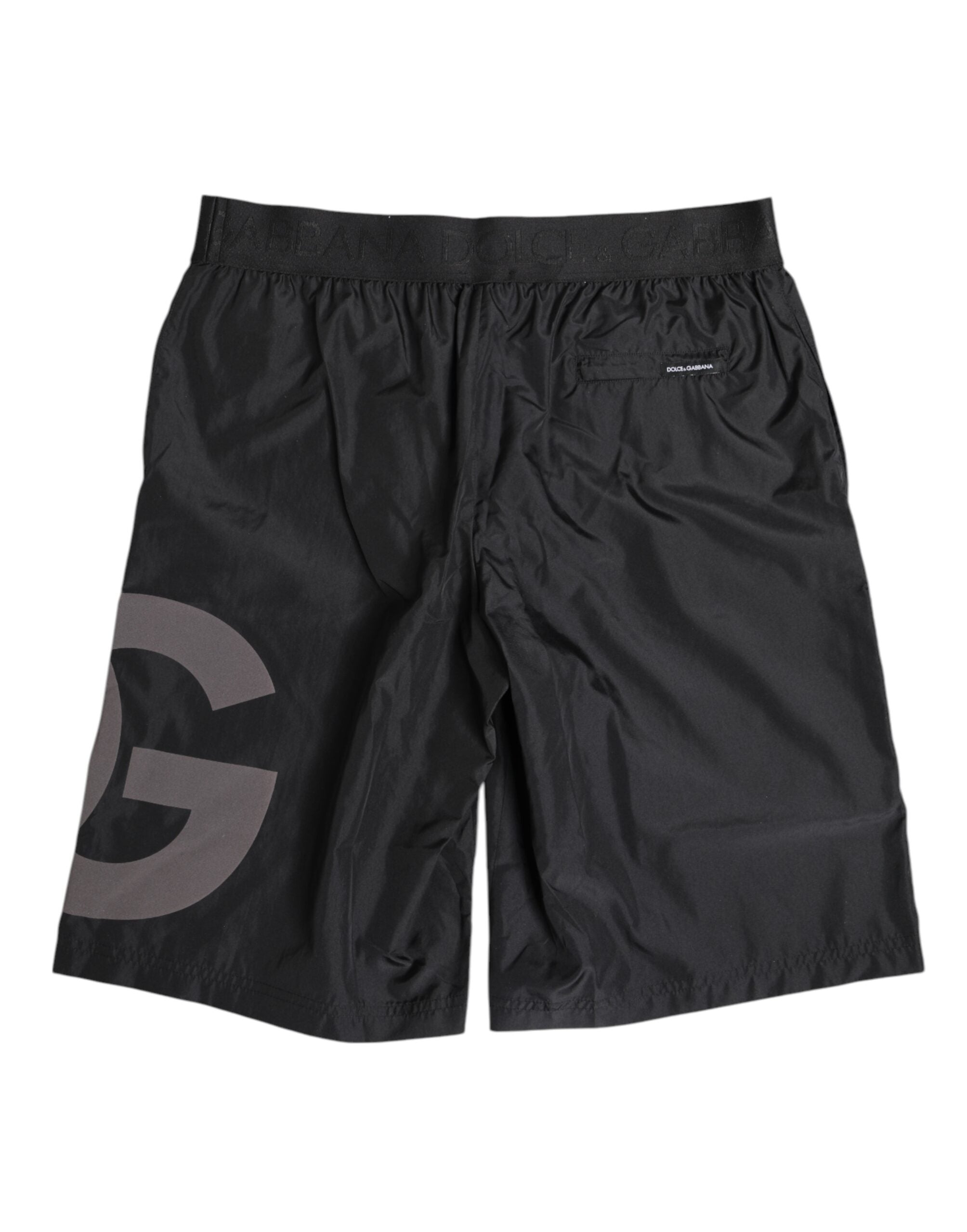 Shorts de bain pour homme Dolce & Gabbana avec logo noir, style plage, matériel léger et design élégant.