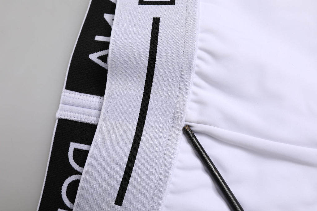Boxers en nylon blanc Dolce & Gabbana avec logo à la taille, confort et style pour homme.
