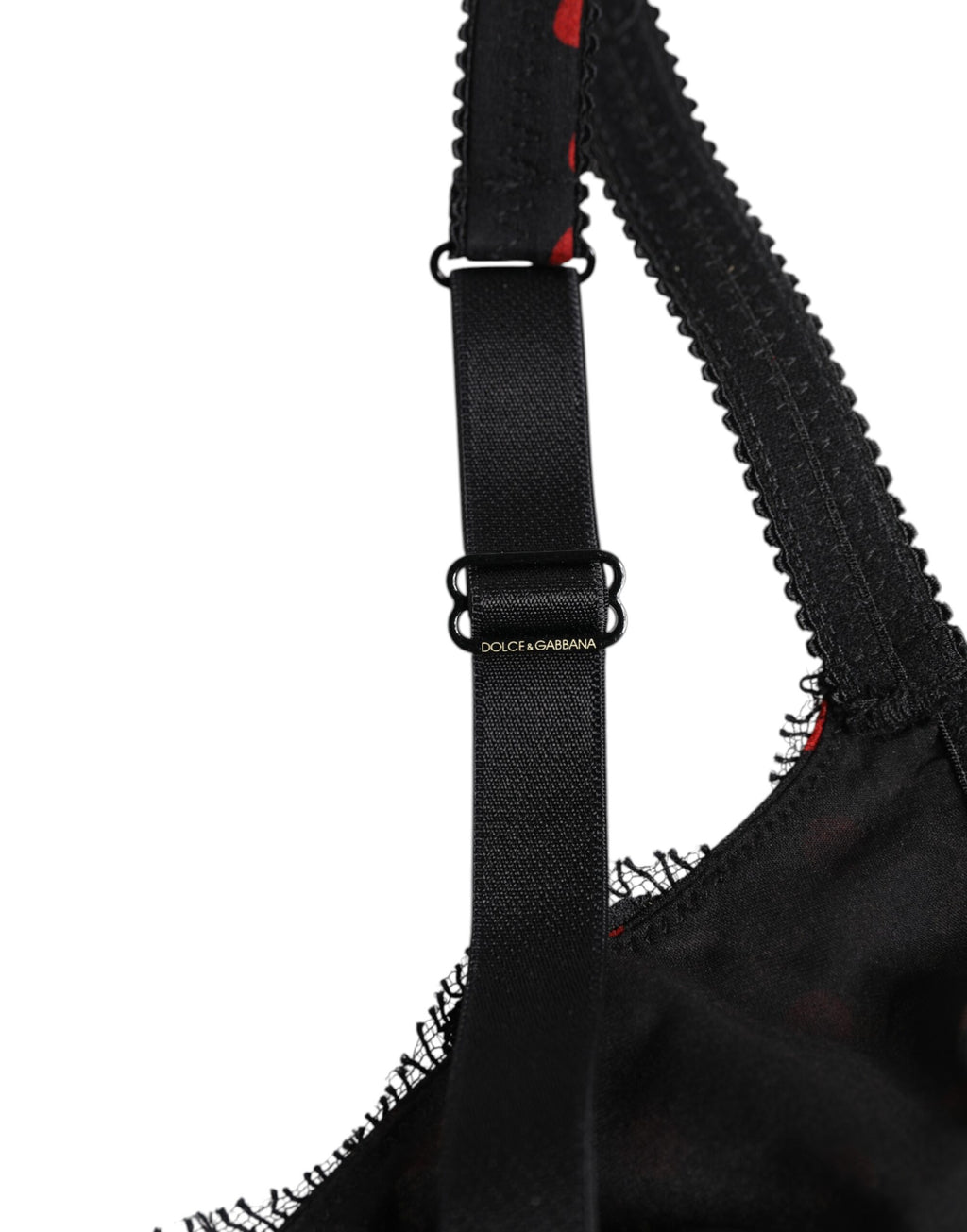 Sous-vêtements Dolce & Gabbana en dentelle noire et rouge à pois, balconnet et avec armatures pour un maintien élégant.