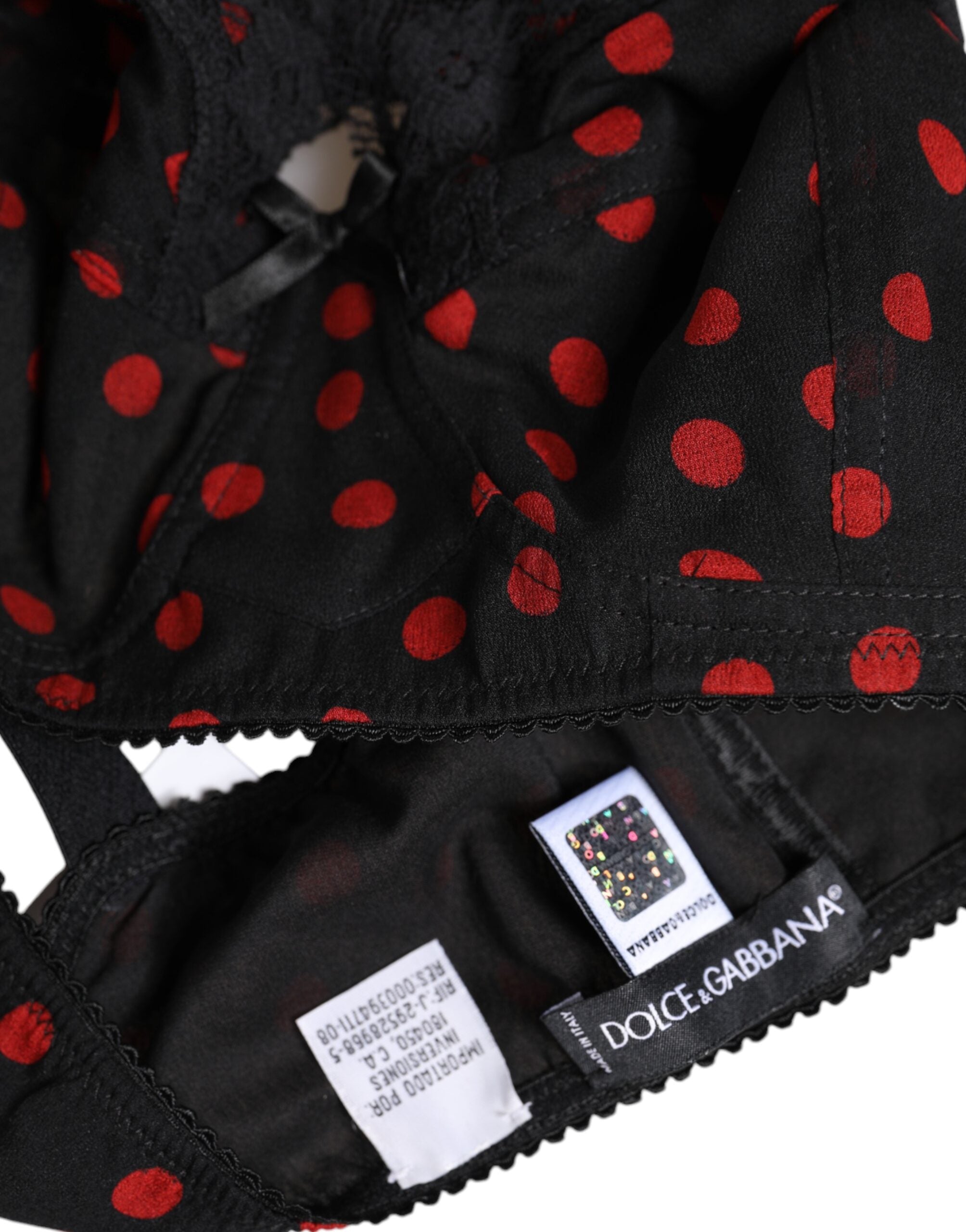 Sous-vêtements Dolce & Gabbana en dentelle noire et rouge à pois, soutien-gorge balconnet avec armatures, élégant et féminin.