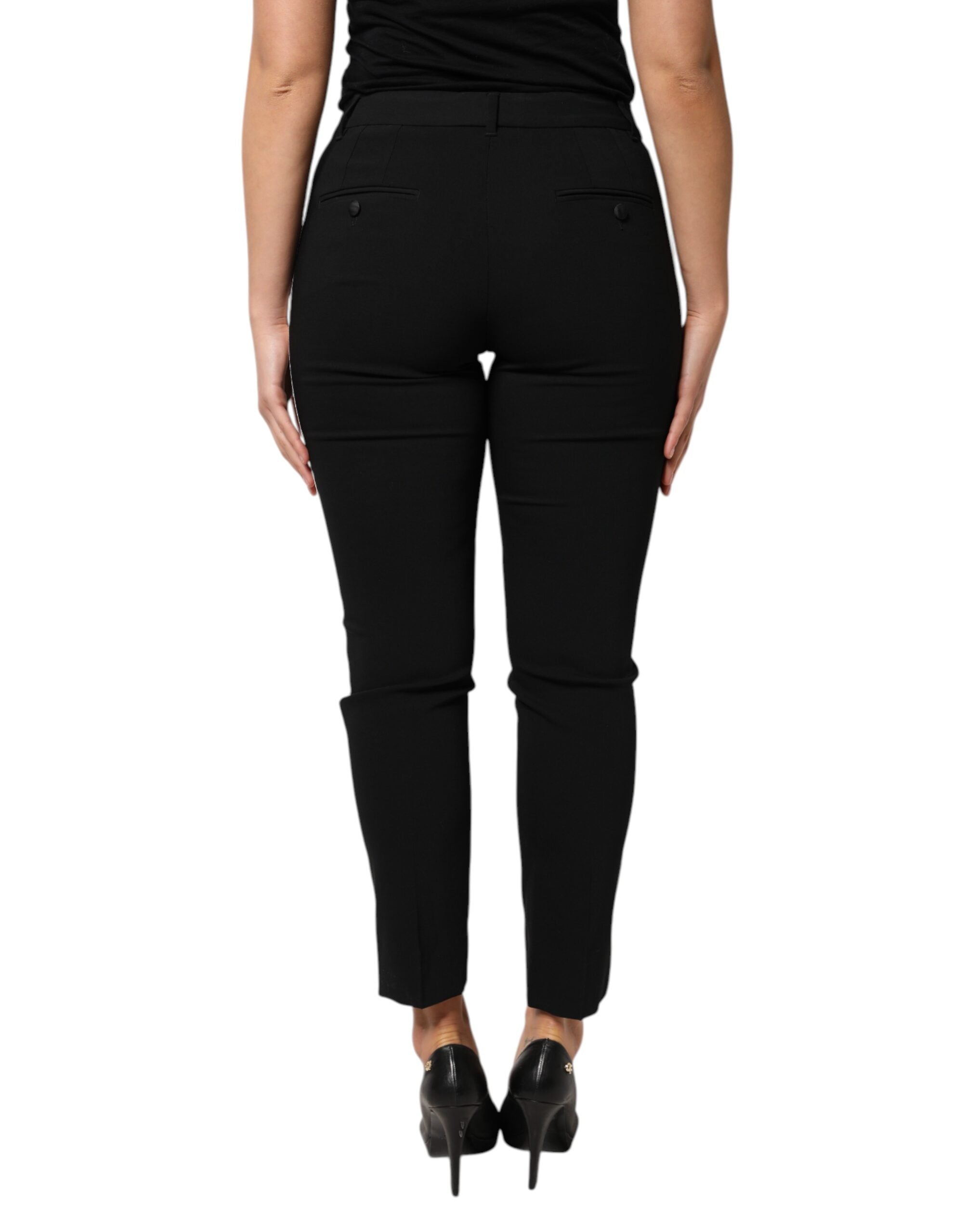 Pantalon noir en laine Dolce & Gabbana à taille haute et coupe tapered, vue de face sur fond blanc.