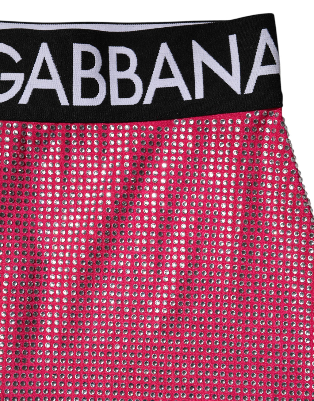 Mini jupe Dolce & Gabbana rose avec logo orné de strass et embellissements brillants, style élégant et tendance.