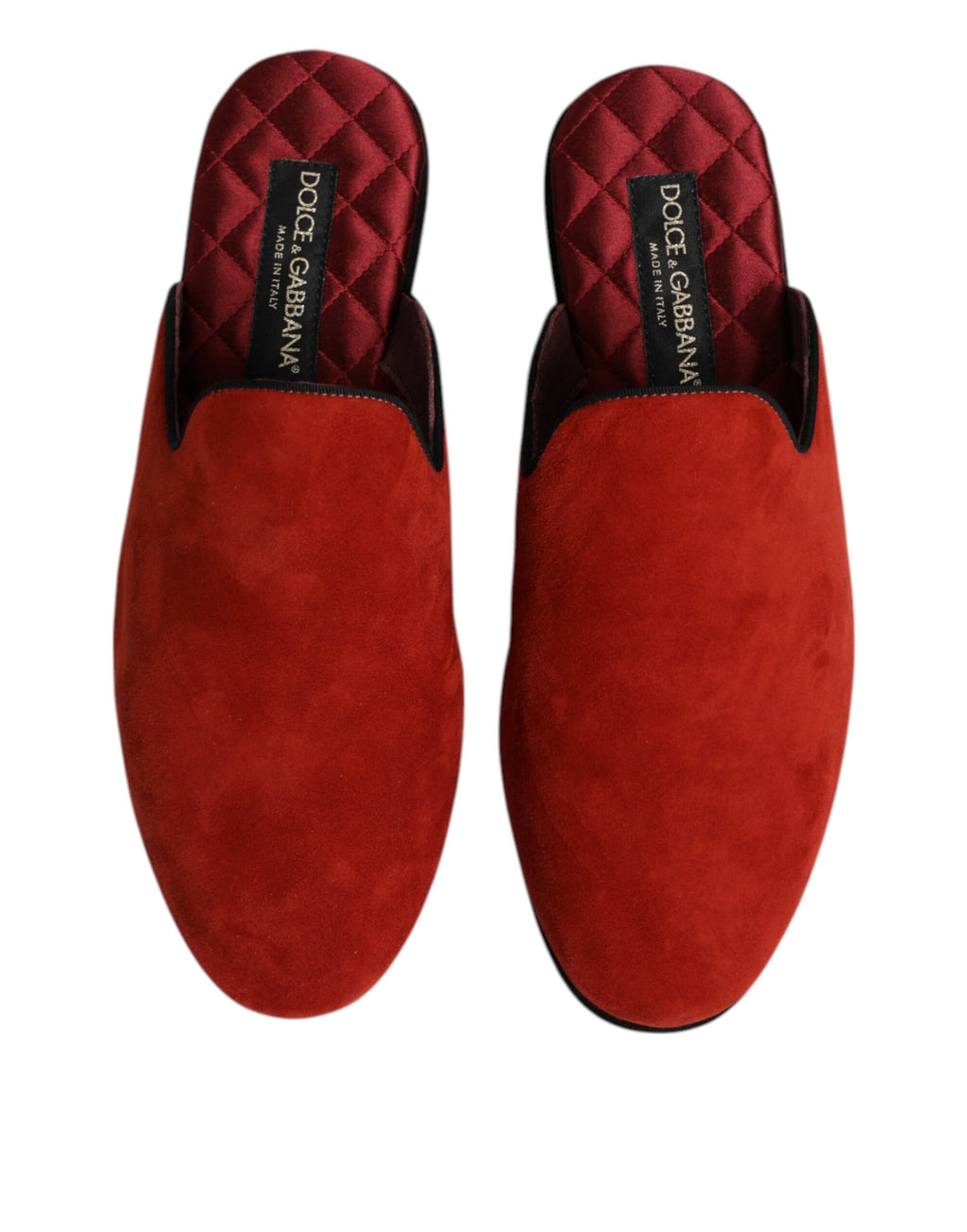 Chaussures Dolce & Gabbana en daim orange, slippers plates et confortables, pieds visibles dans l'image.