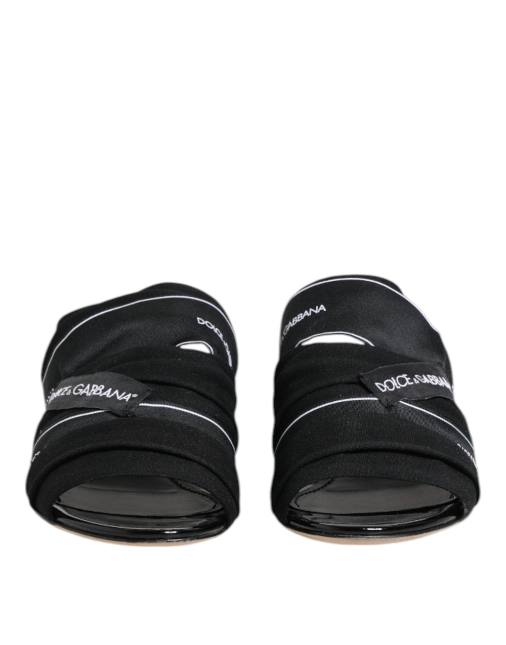 Sandales noires Dolce & Gabbana à enfiler, chaussures élégantes en cuir avec design épuré et confort moderne.