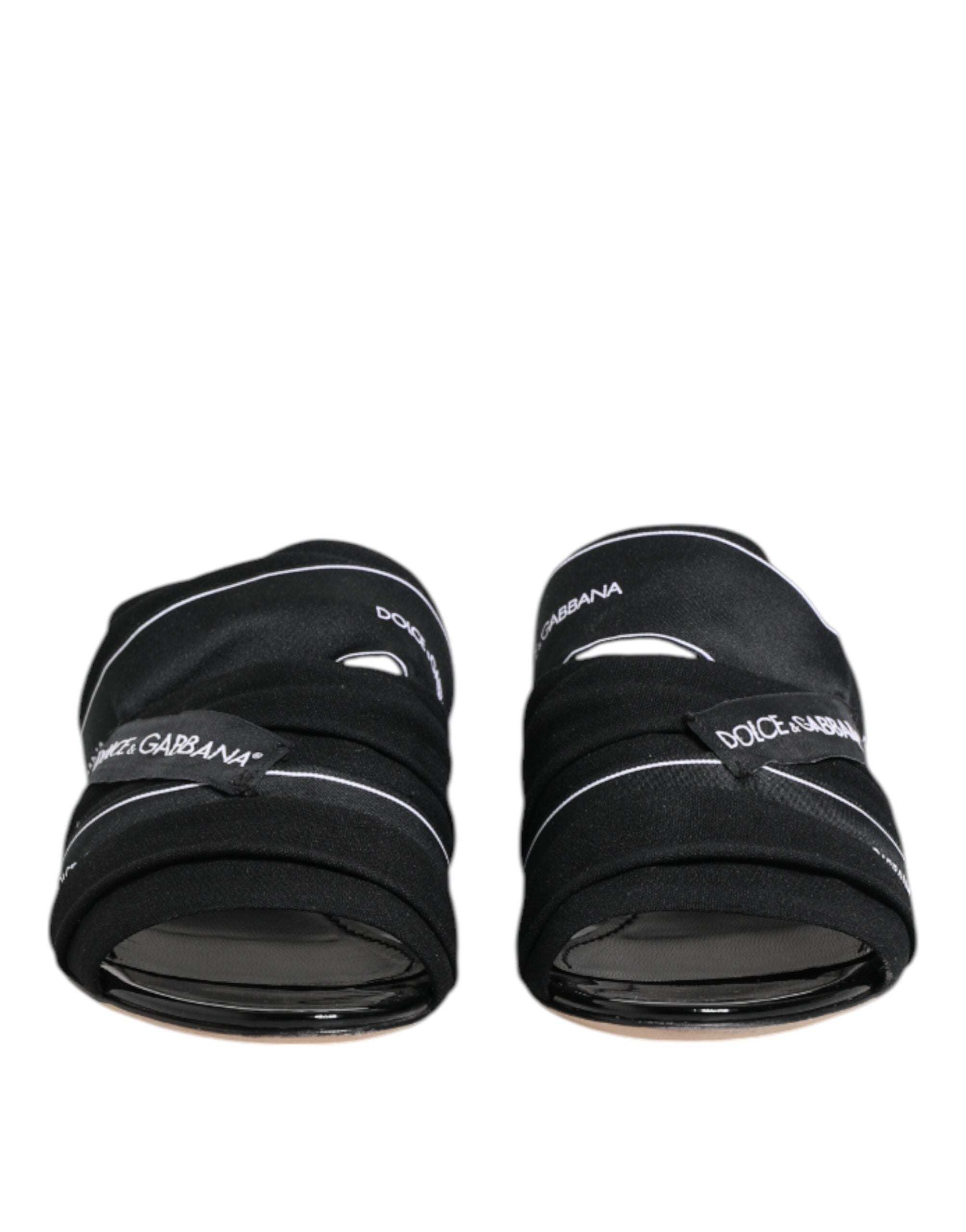 Sandales noires Dolce & Gabbana à enfiler, chaussures élégantes en cuir avec design épuré et confort moderne.