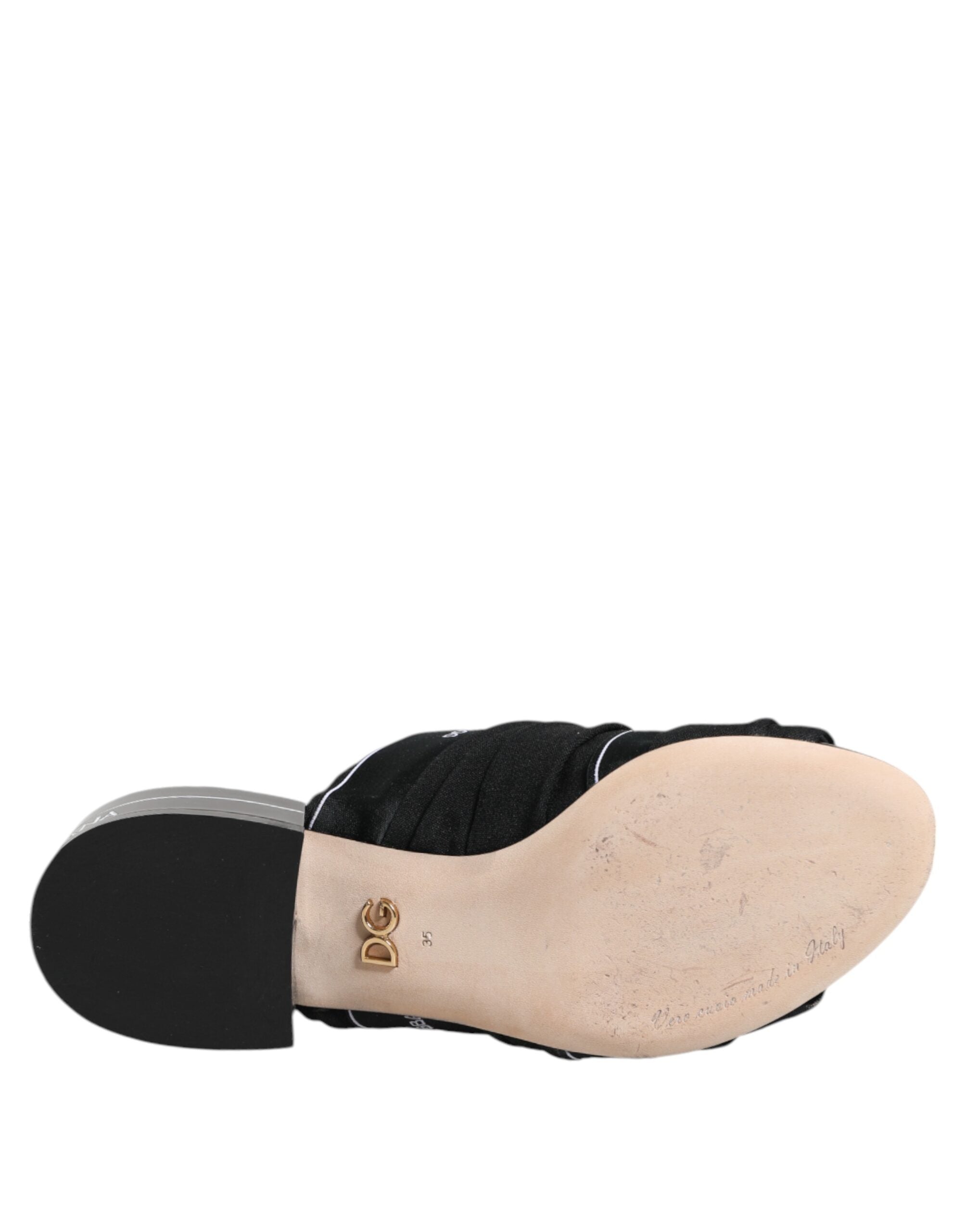 Sandales noires Dolce & Gabbana Slip-On, chaussures élégantes en cuir avec design minimaliste et confort.