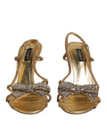 Sandales à talons dorés Dolce & Gabbana avec bride à la cheville ornée de strass, élégantes et sophistiquées.