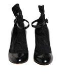 Chaussures à talons Dolce & Gabbana en cuir noir avec lacets, style pumps élégants et sophistiqués.