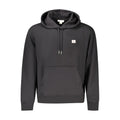 Sweat-shirt noir en coton pour homme de la marque Calvin Klein, coupe décontractée, logo discret sur la poitrine.