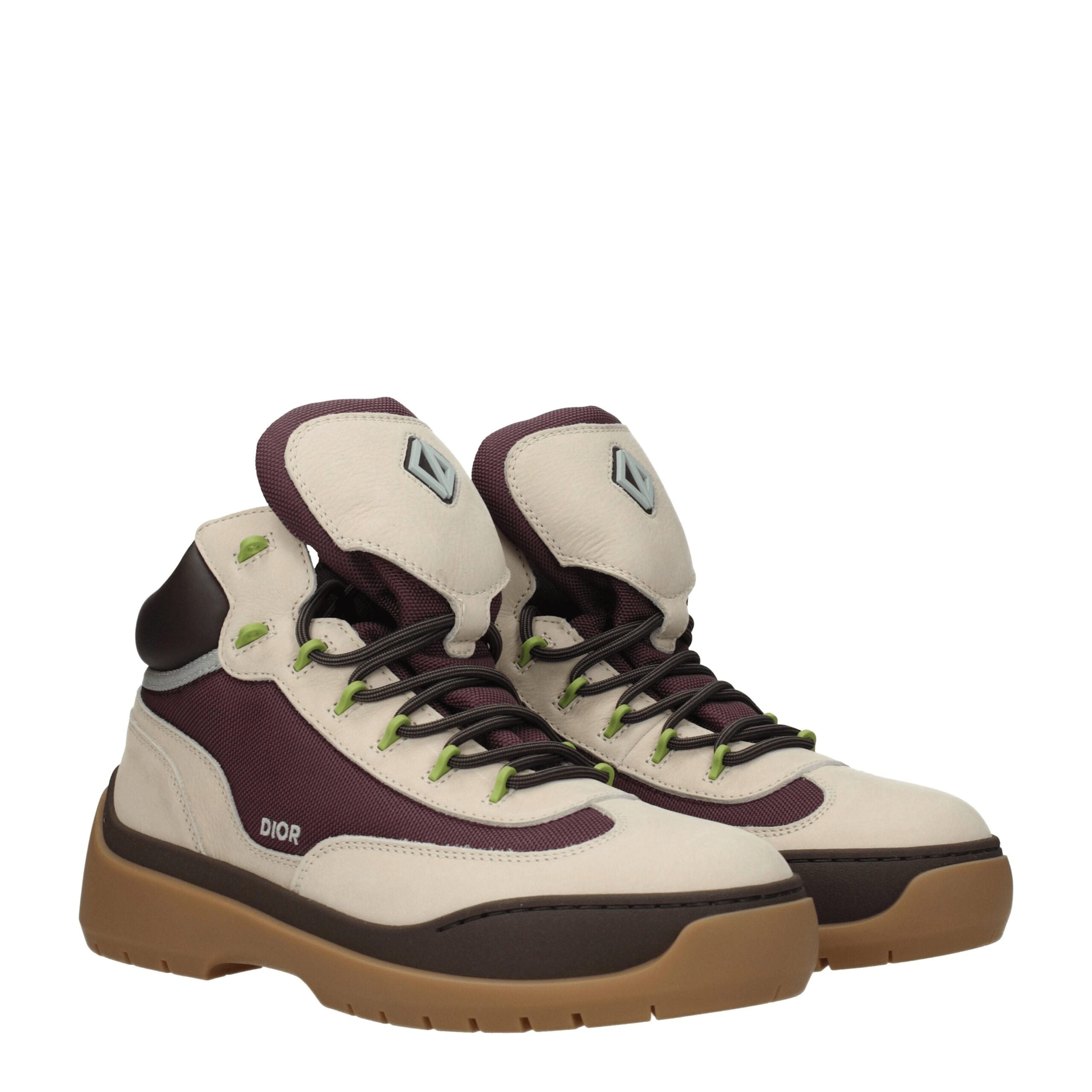Bottes ankle en cuir beige de Christian Dior, mode élégante et sophistiquée, visibles avec fermeture et détails en cuir.