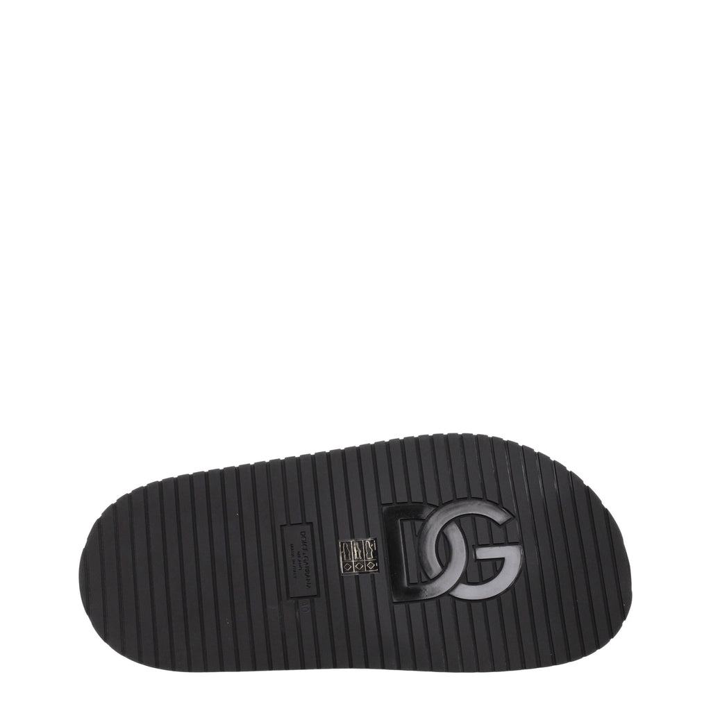 Chaussures slippers en cuir noir Dolce & Gabbana, élégantes et confortables pour homme.