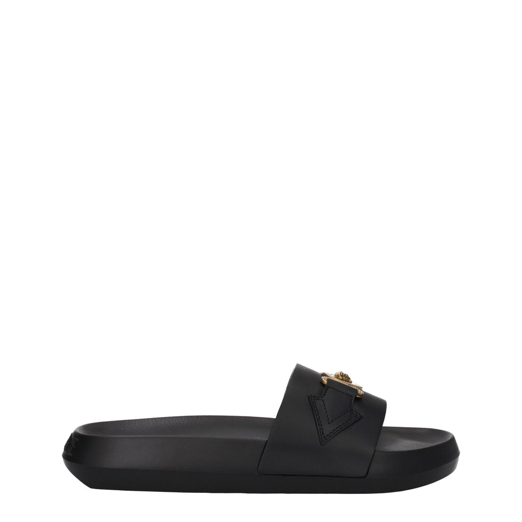 Pantoufles en cuir noir Versace, chaussures élégantes pour homme avec logo distinctif, visibles sur l'image.
