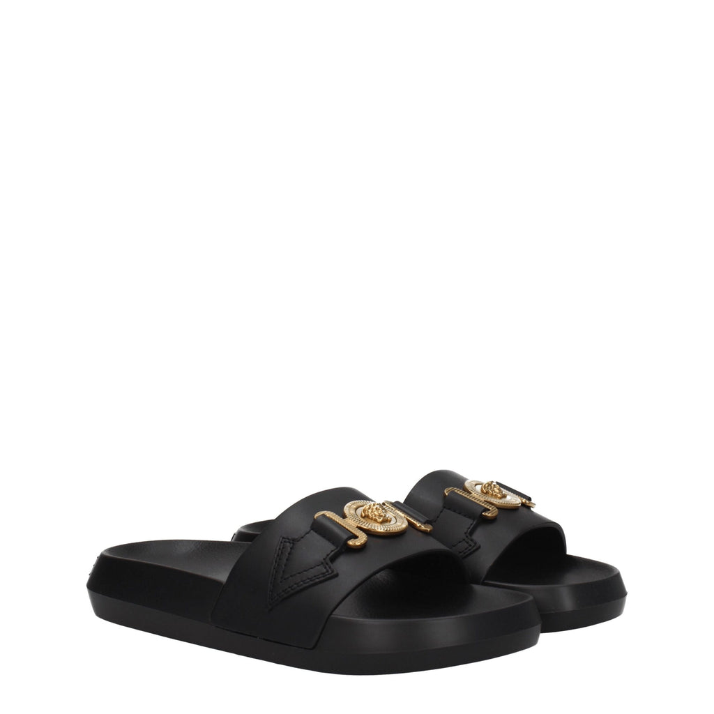 Pantoufles en cuir noir Versace, élégantes et confortables, avec logo distinctif, parfaites pour un style sophistiqué.