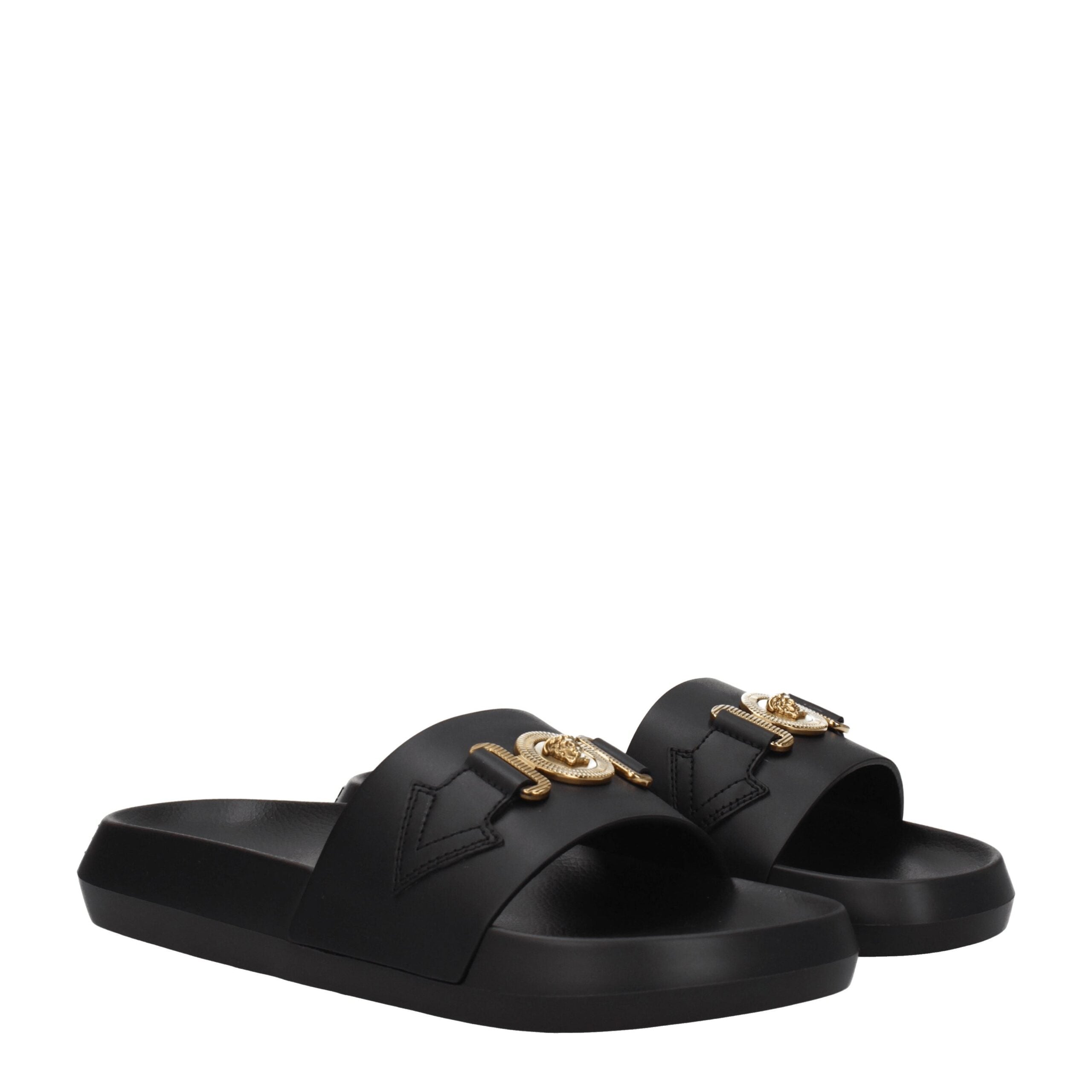 Chaussures slippers en cuir noir de marque Versace, détails élégants et design sophistiqué pour un style haut de gamme.