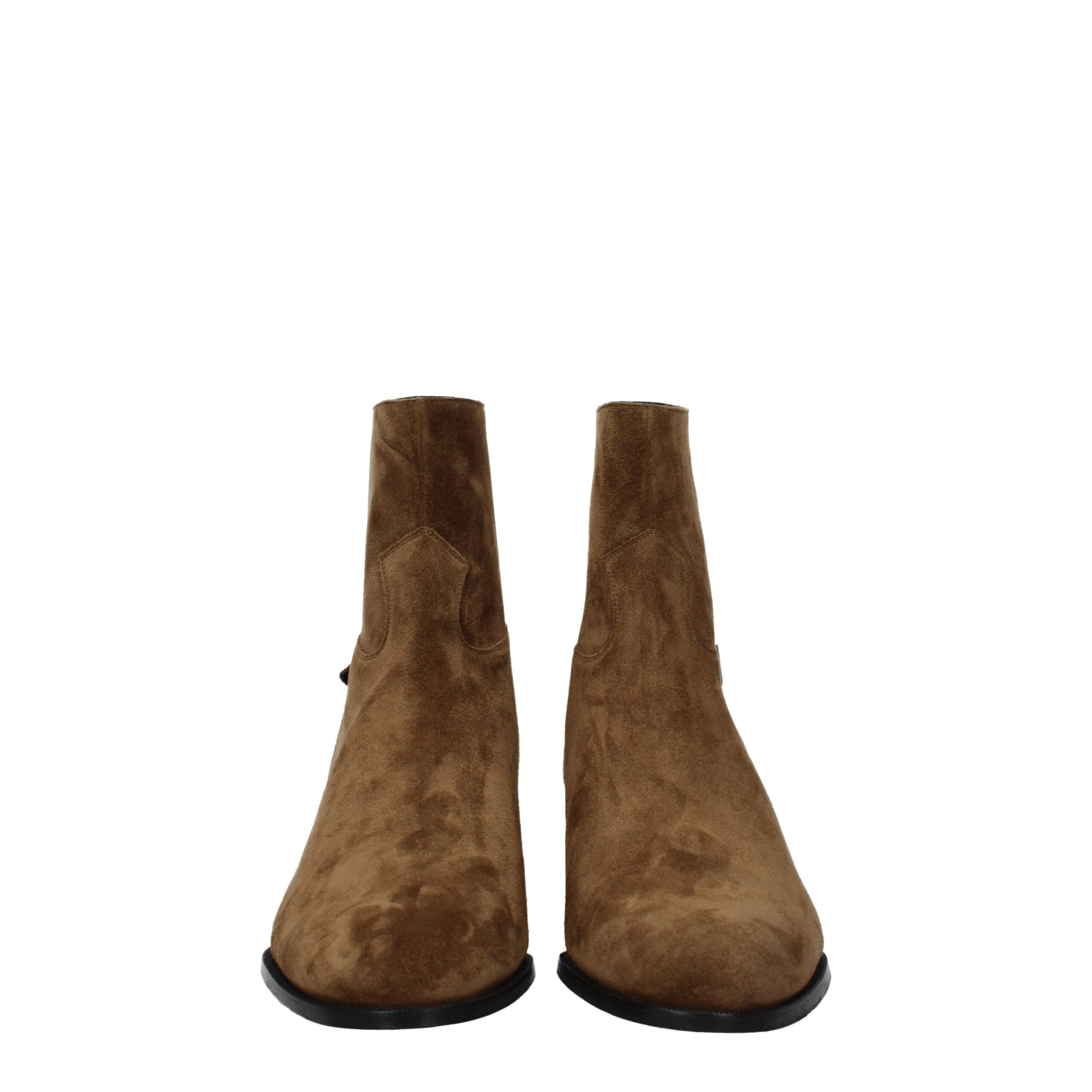 Bottes Chelsea en cuir marron de Celine, ankle boots élégantes avec finition lisse et semelle en caoutchouc.