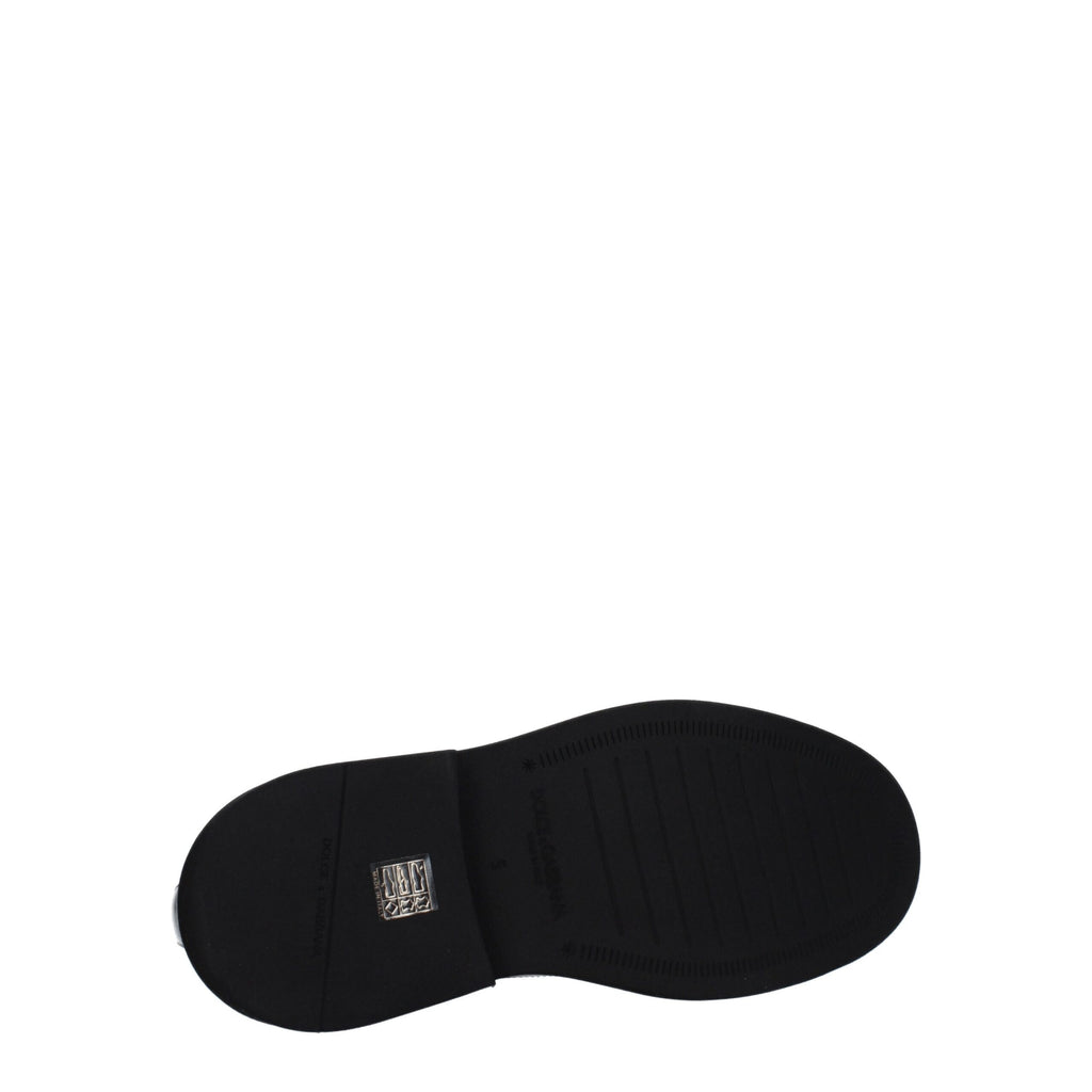 Chaussures Oxford et derbies en cuir noir de Dolce & Gabbana, élégantes et sophistiquées, vues de face sur fond blanc.