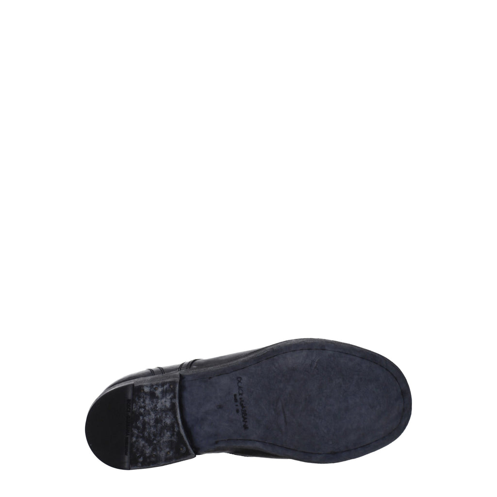 Chaussures Oxford et Derby en cuir noir de Dolce & Gabbana, élégantes et sophistiquées, visibles en gros plan.
