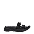 Pantoufles en tissu noir Givenchy, élégantes et confortables, avec logo subtil visible sur le dessus.
