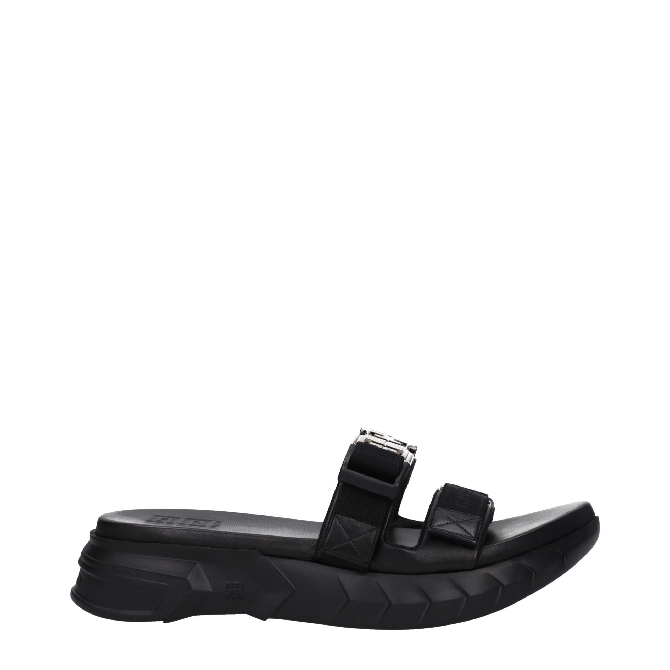 Pantoufles en tissu noir Givenchy, élégantes et confortables, avec logo subtil visible sur le dessus.