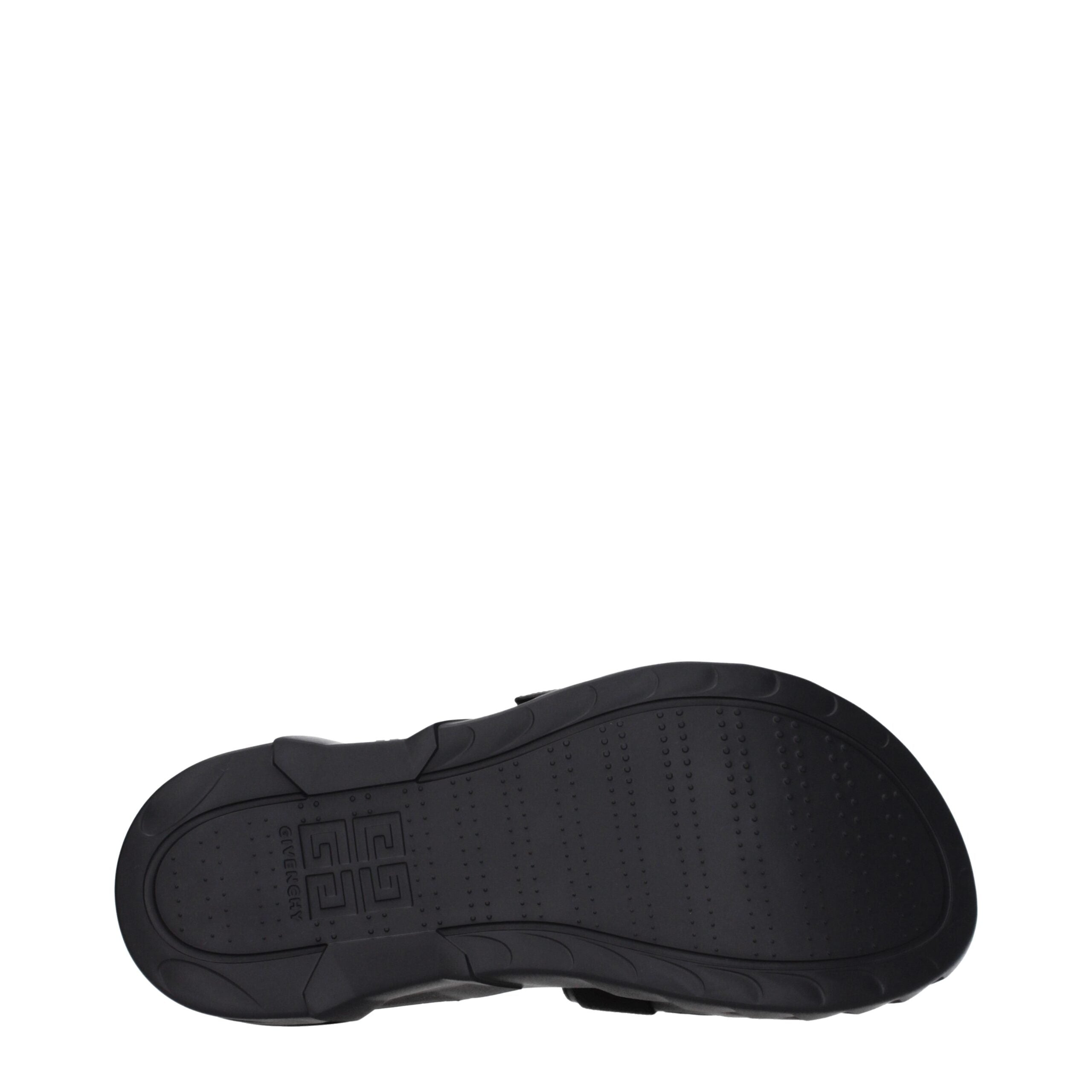 Chaussons en tissu noir de Givenchy, élégants et confortables, pour un style sophistiqué.